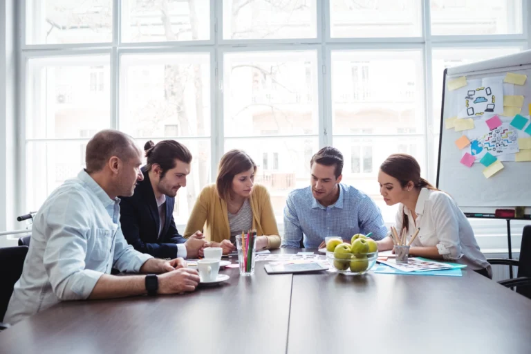Business team collaborating during a meeting — building a successful RPO partnership